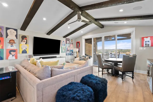 a view of a patio with table and chairs and potted plants