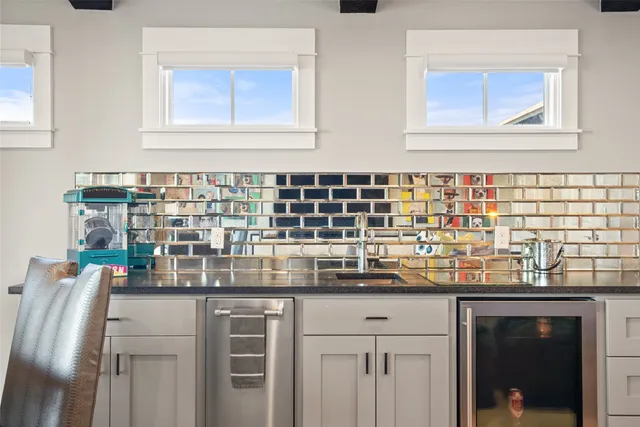 a view of a swimming pool with a patio and garden