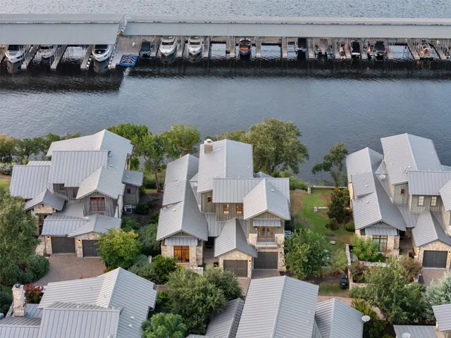 an aerial view of house with lake view