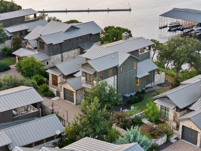 a house with a clock on the side of it