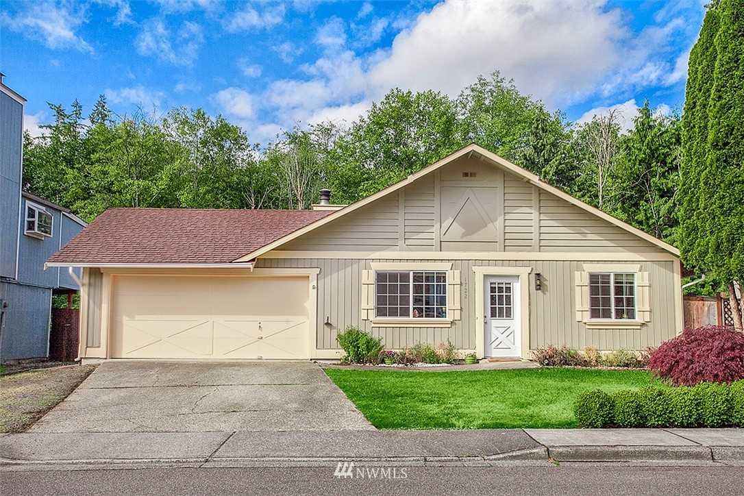 1722 225th Street Southeast Bothell, WA 98021 - Photo 1 of 19 a front view of a house with a garden