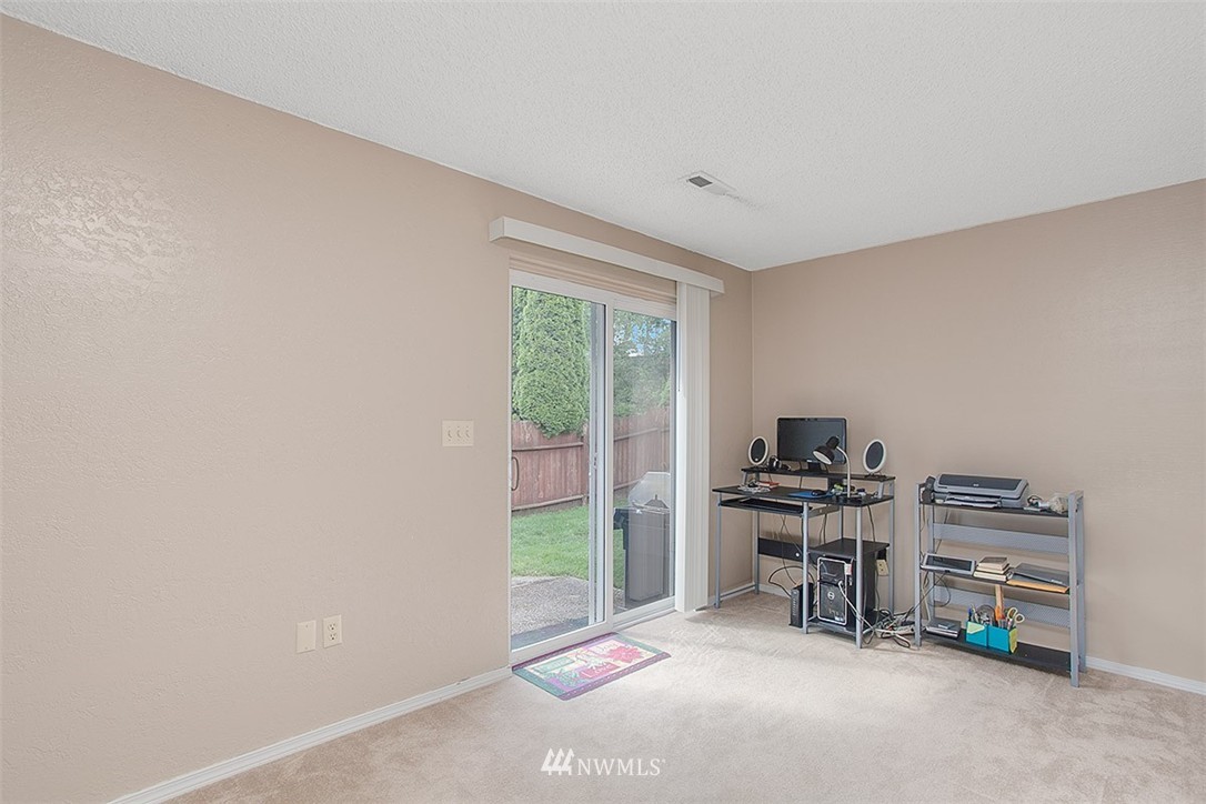 1722 225th Street Southeast Bothell, WA 98021 - Photo 11 of 19 a workspace with furniture and a window