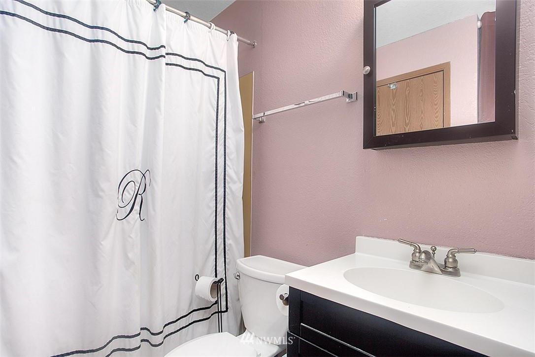 1722 225th Street Southeast Bothell, WA 98021 - Photo 17 of 19 a bathroom with a sink and a mirror