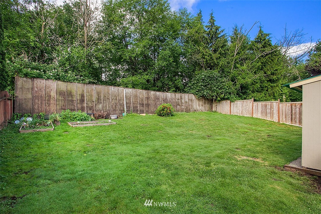 1722 225th Street Southeast Bothell, WA 98021 - Photo 19 of 19 a view of a backyard with a garden