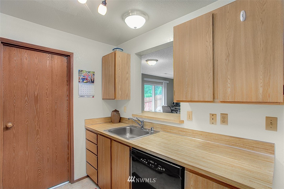 1722 225th Street Southeast Bothell, WA 98021 - Photo 8 of 19 a kitchen with a sink and cabinets