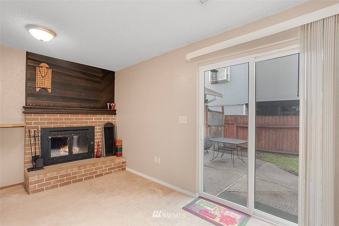 1722 225th Street Southeast Bothell, WA 98021 - Photo 10 of 19 a living room with furniture and a fireplace