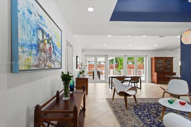 a living room with furniture and a painting