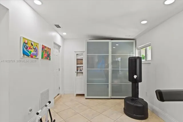 a bedroom with a bed and a desk