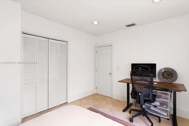 a bed room with furniture and a wooden floor