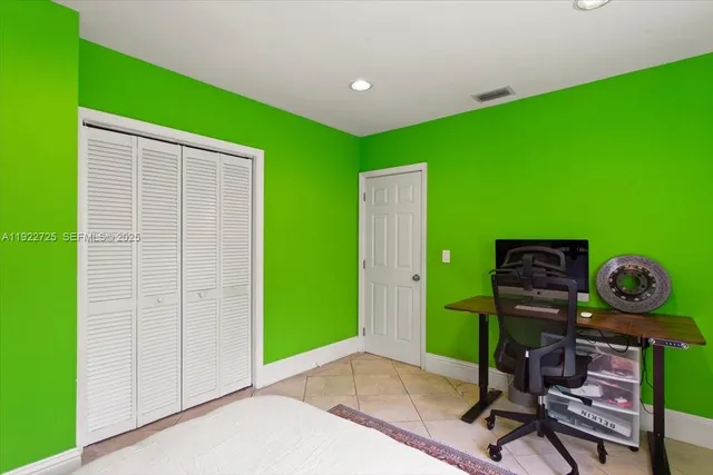 a bedroom with a bed and a table