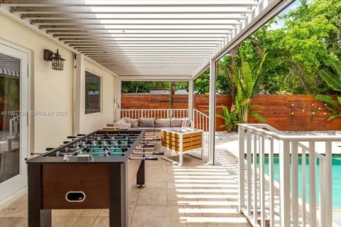 a view of balcony with wooden floor