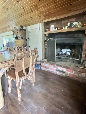 a view of a room with furniture and a fireplace