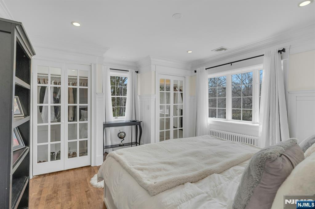 8 Glenwood Road Denville, NJ 07834 - Photo 11 of 37 a bedroom with a large bed and windows