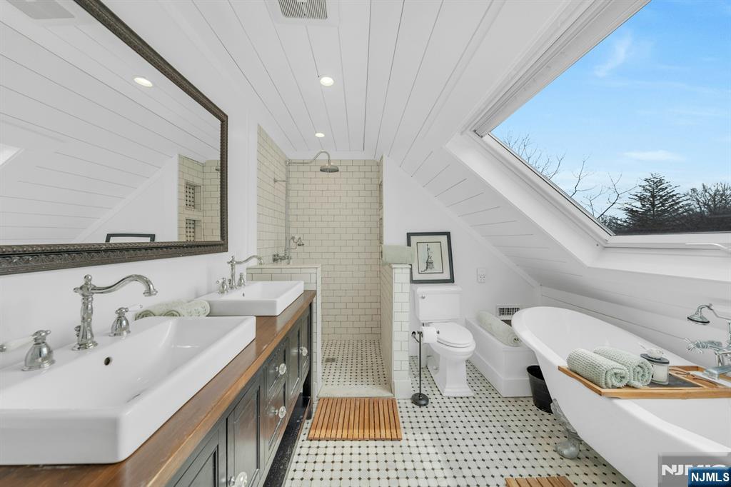 8 Glenwood Road Denville, NJ 07834 - Photo 17 of 37 a bathroom with a double vanity sink mirror and toilet
