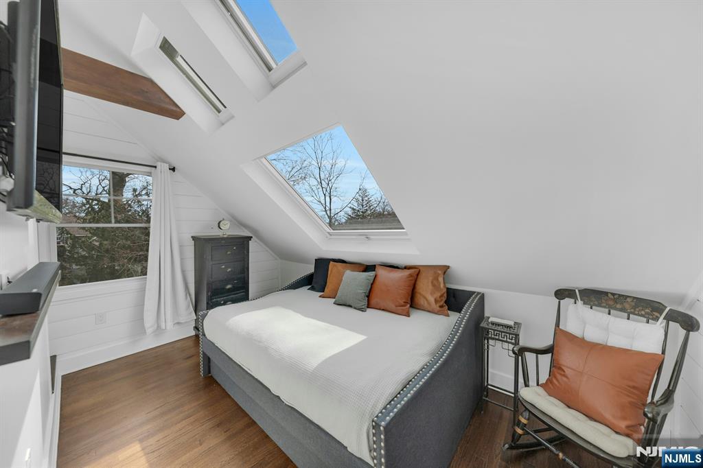 8 Glenwood Road Denville, NJ 07834 - Photo 20 of 37 a bedroom with a bed and chair