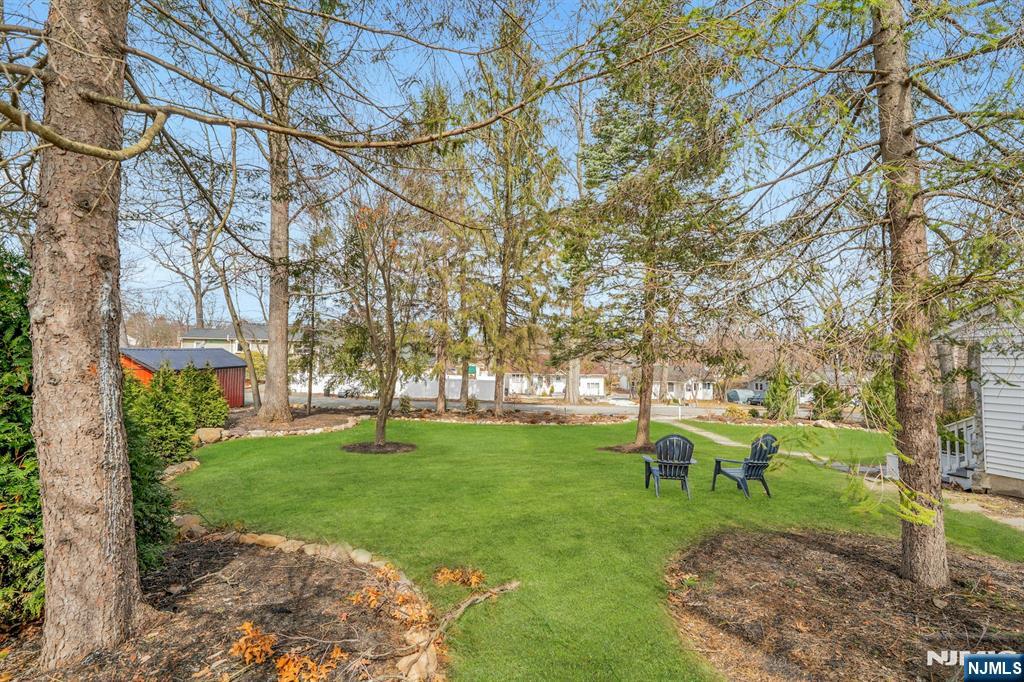 8 Glenwood Road Denville, NJ 07834 - Photo 29 of 37 a backyard of a house with table and chairs