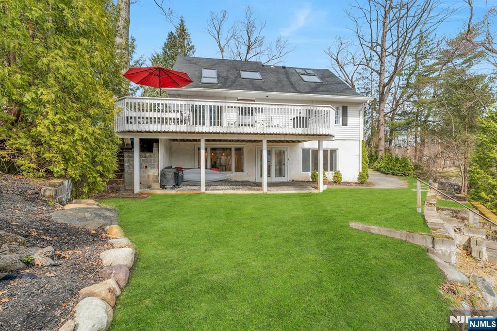 8 Glenwood Road Denville, NJ 07834 - Photo 30 of 37 a view of a house with a backyard and a patio