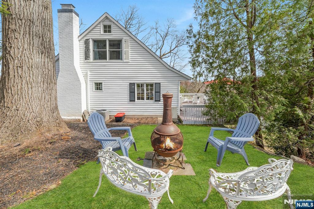 8 Glenwood Road Denville, NJ 07834 - Photo 32 of 37 a backyard of a house with table and chairs