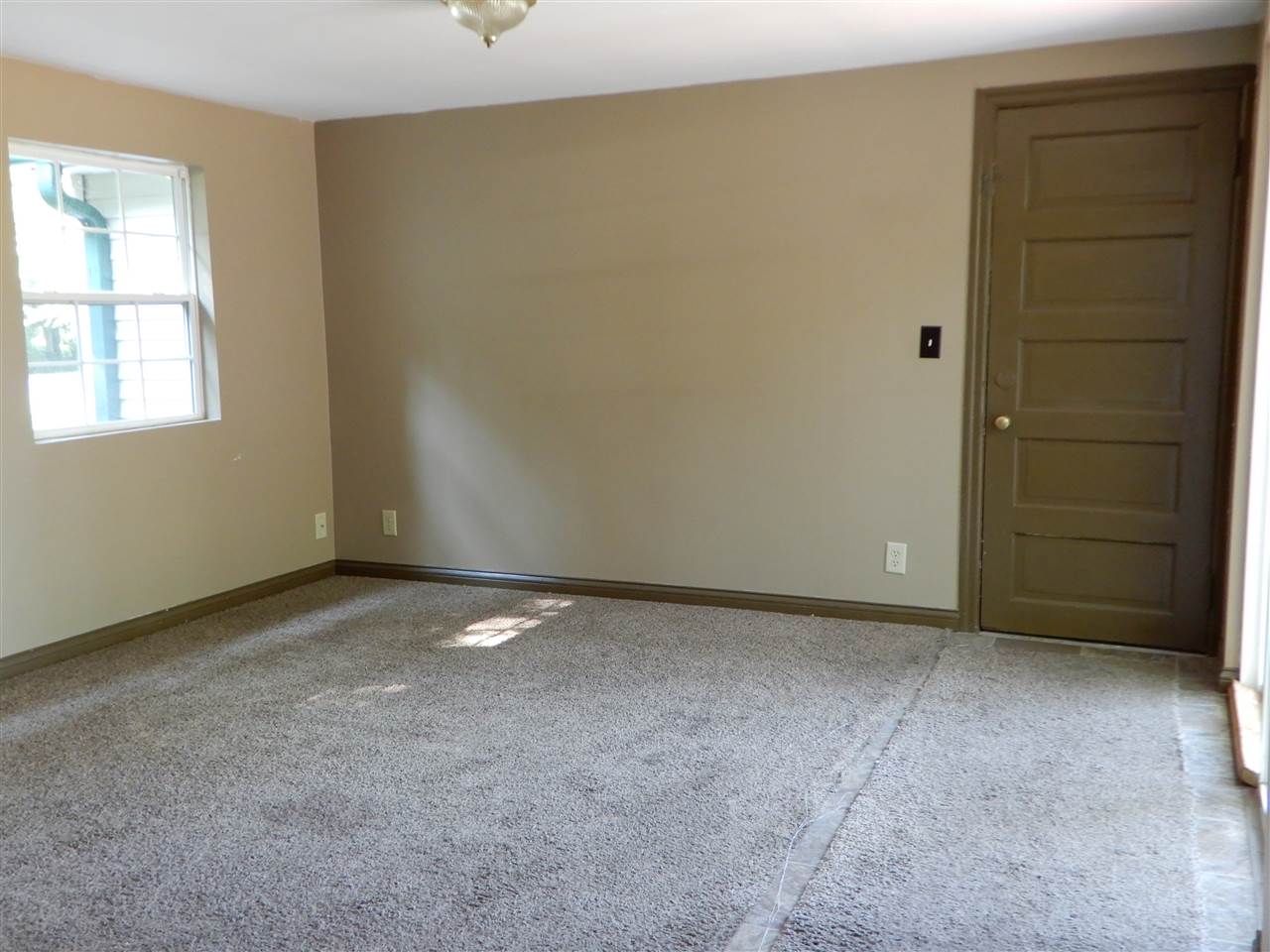 2304 Mill Road Cherry Valley, IL 61016 - Photo 6 of 20 an empty room with a empty space and window