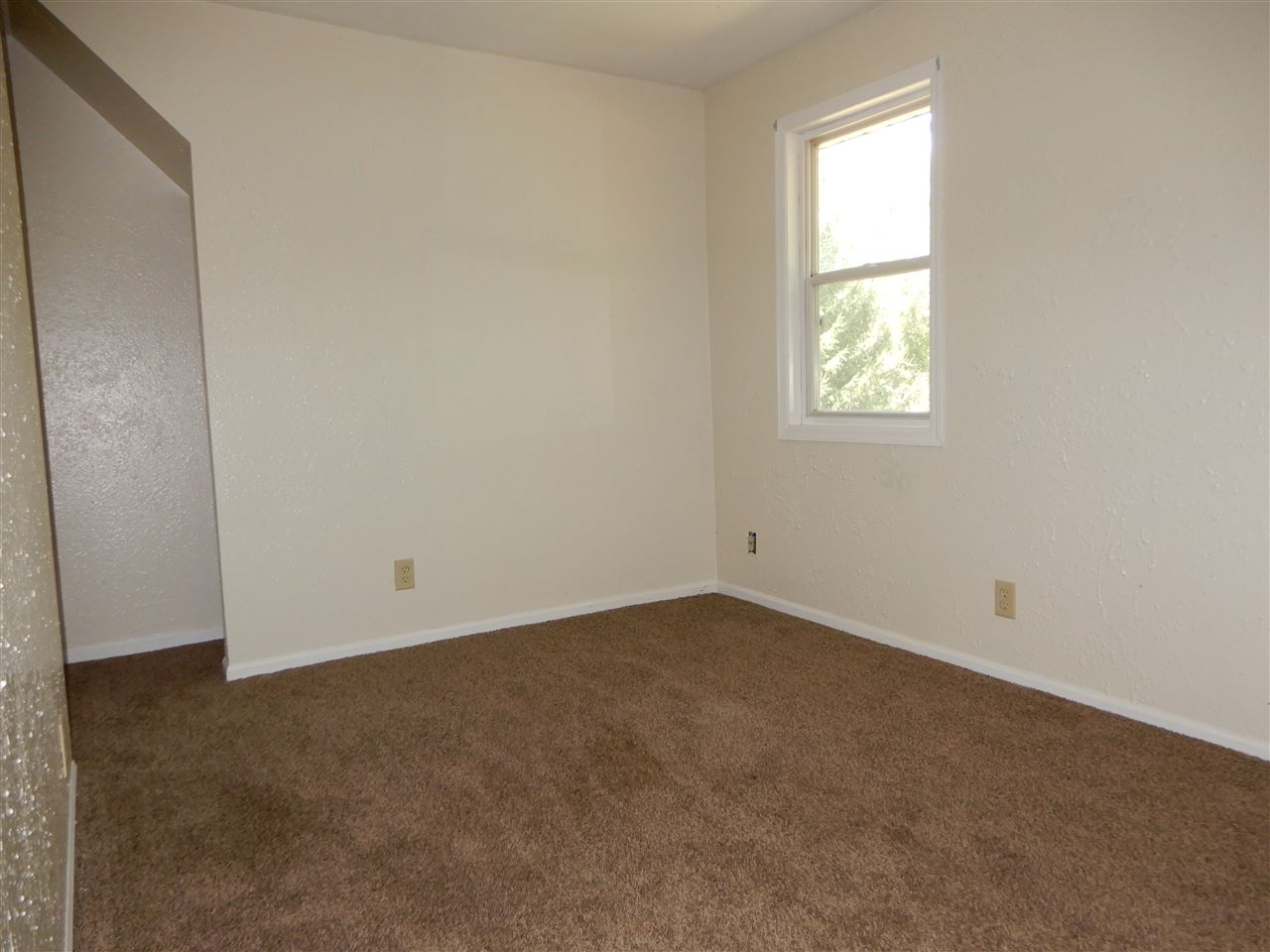 2304 Mill Road Cherry Valley, IL 61016 - Photo 10 of 20 an empty room with a window