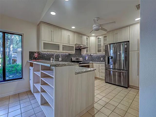 a dining room with wooden floor and window