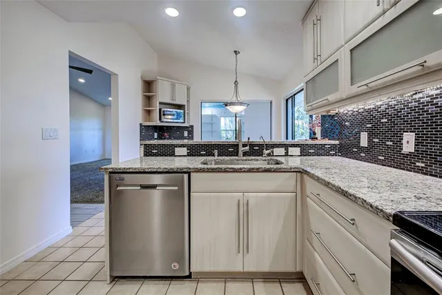 a bedroom with a bed and a dresser in it