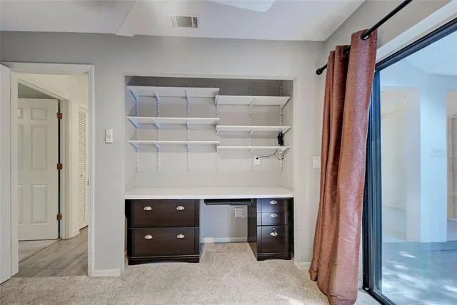 a dining hall view with a dining table chairs and couches