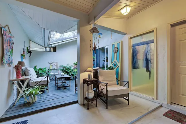 a living room with furniture and a window