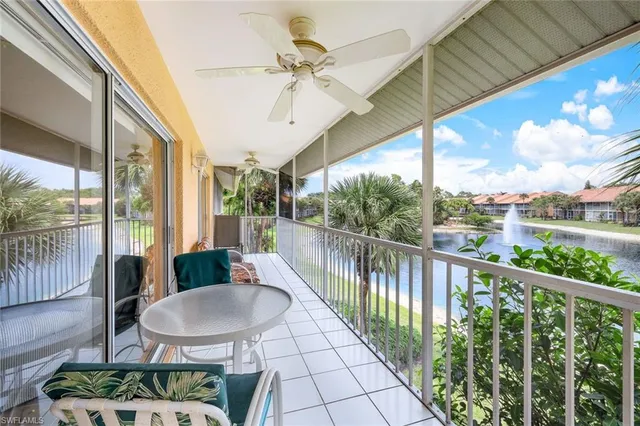a view of a balcony with furniture