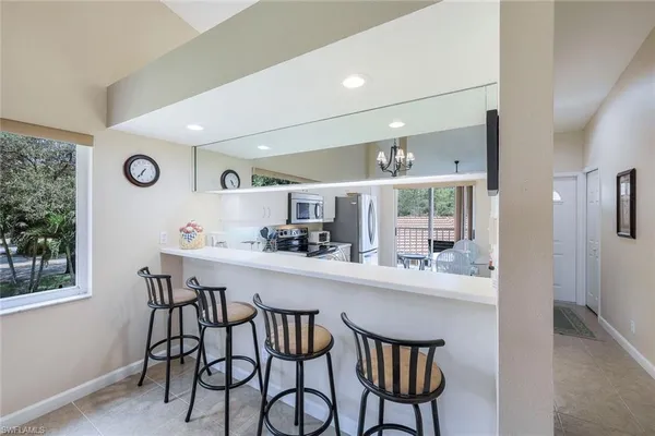 a kitchen with a table and chairs in it