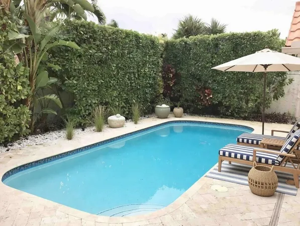 a view of a swimming pool with a patio