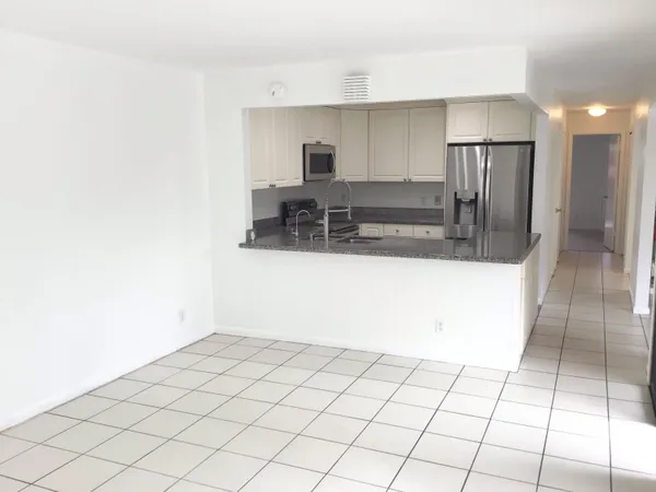 a view of a kitchen with a sink