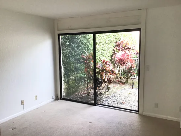 a view of a room with a large window