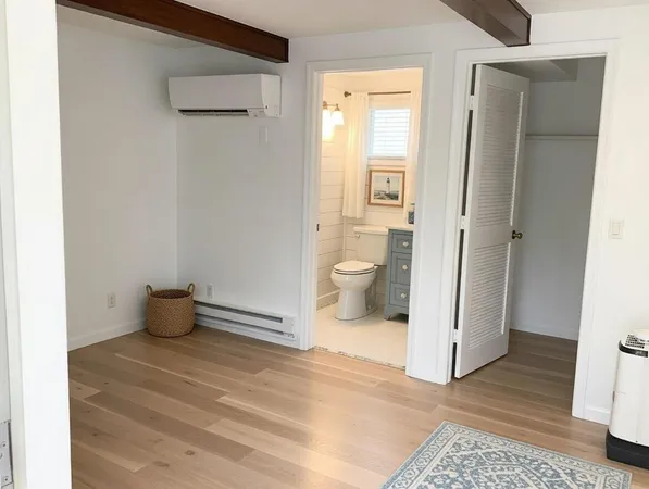 a bathroom with a toilet and a sink
