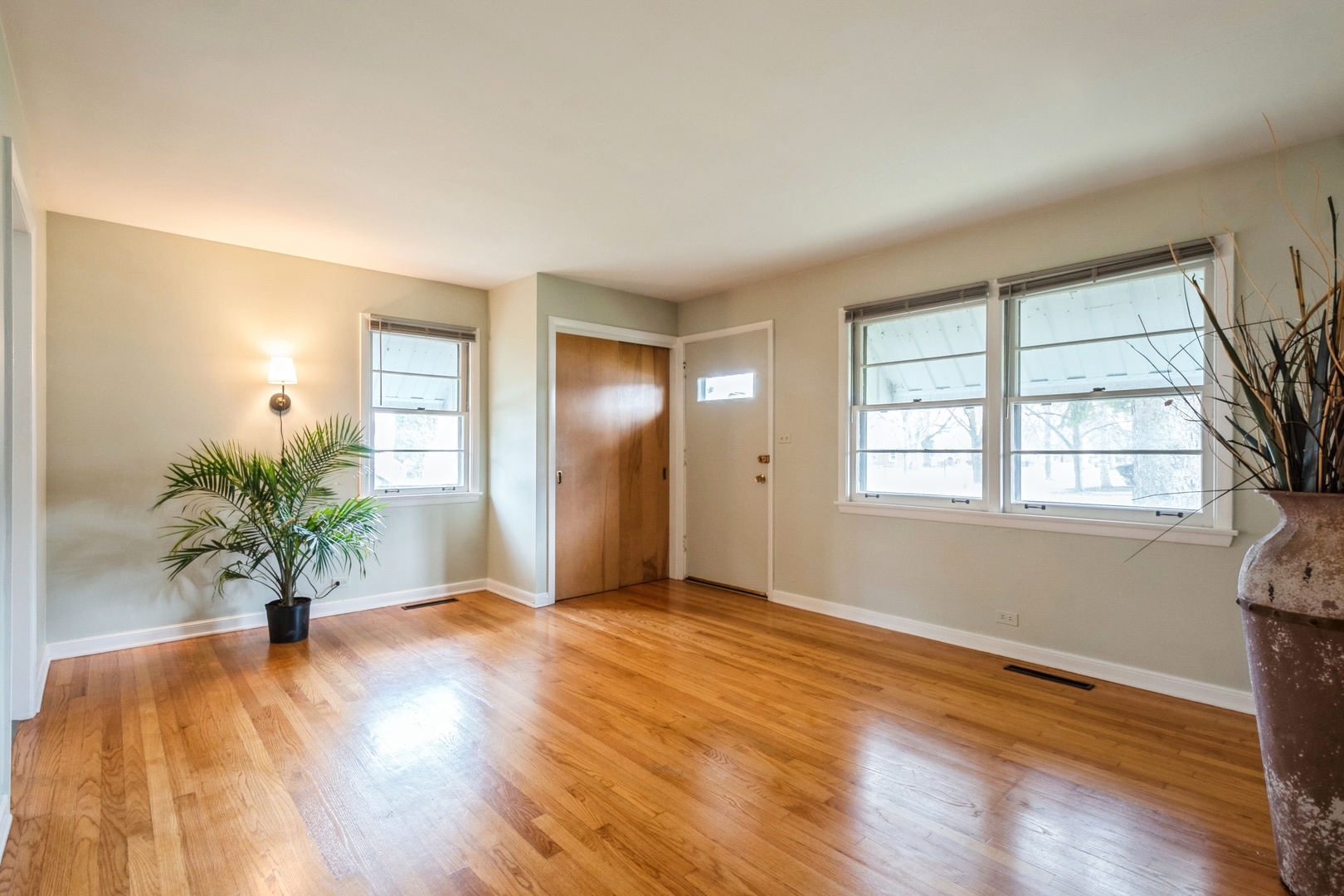 735 Chestnut Street Deerfield, IL 60015 - Photo 3 of 18 an empty room with window and wooden floor