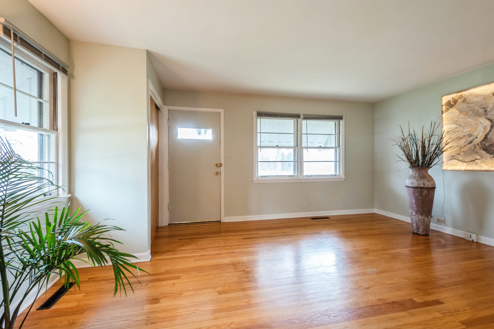 735 Chestnut Street Deerfield, IL 60015 - Photo 4 of 18 wooden floor in an empty room with a window