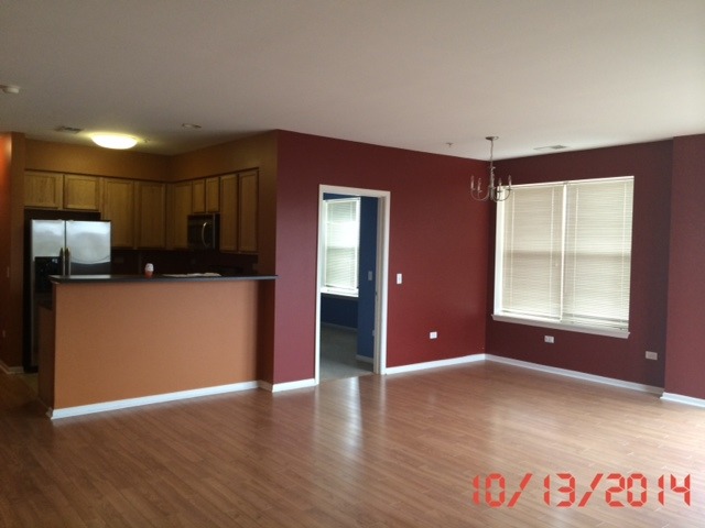 3522 South State Street, Unit 301 Chicago, IL 60609 - Photo 6 of 12 a view of a kitchen with a sink and a refrigerator