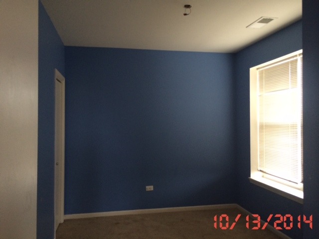 3522 South State Street, Unit 301 Chicago, IL 60609 - Photo 9 of 12 a view of an empty room and a window