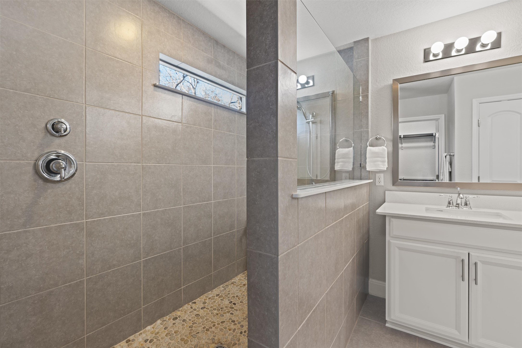 10502 Turnbull Loop, Unit 41 Austin, TX 78717 - Photo 17 of 35 a bathroom with a granite countertop sink a toilet and a mirror