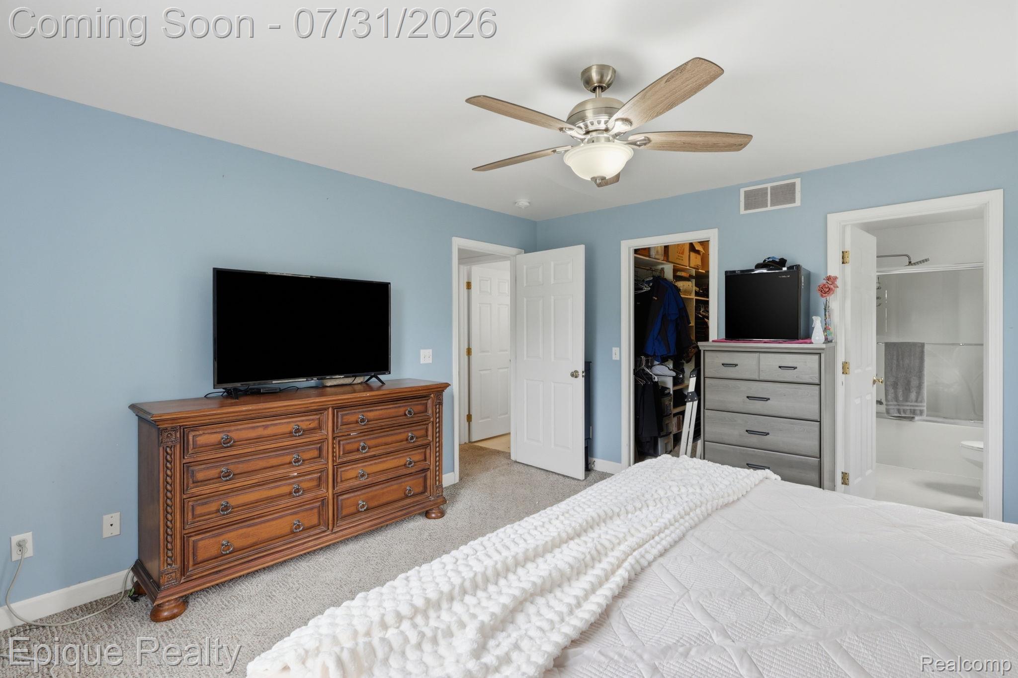 10179 Duffield Road Gaines, MI 48436 - Photo 10 of 30 Room featuring light blue walls and neutral carpet flooring