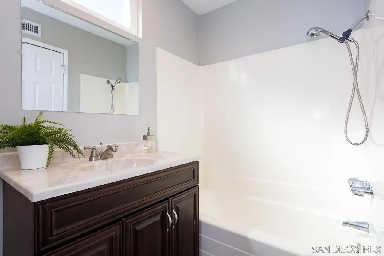 14427 Mirando Street Poway, CA 92064 - Photo 19 of 33 a bathroom with a sink and a mirror