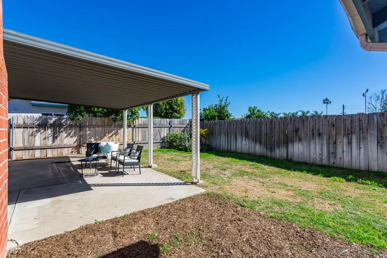 14427 Mirando Street Poway, CA 92064 - Photo 26 of 33 a view of a backyard with sitting area