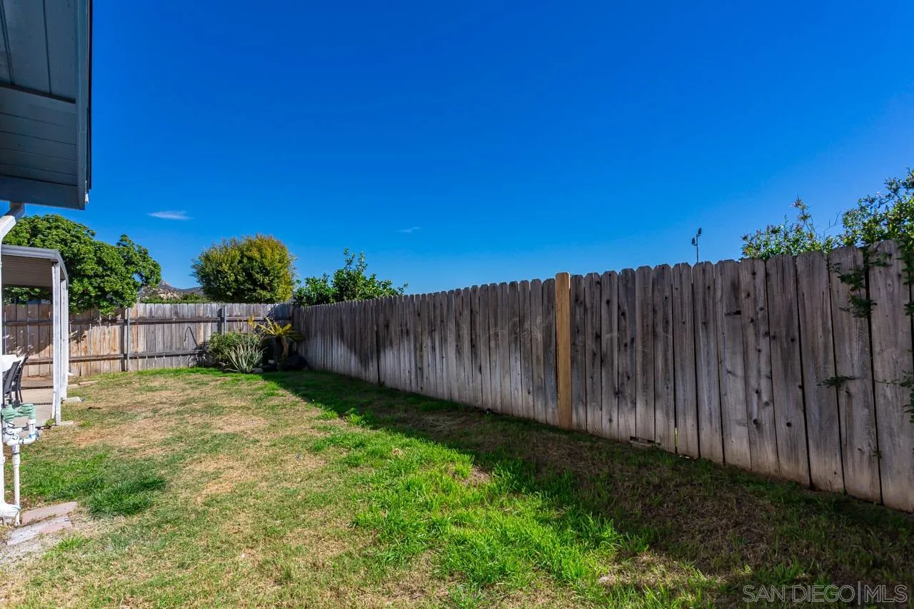 14427 Mirando Street Poway, CA 92064 - Photo 30 of 33 a view of backyard with wooden fence