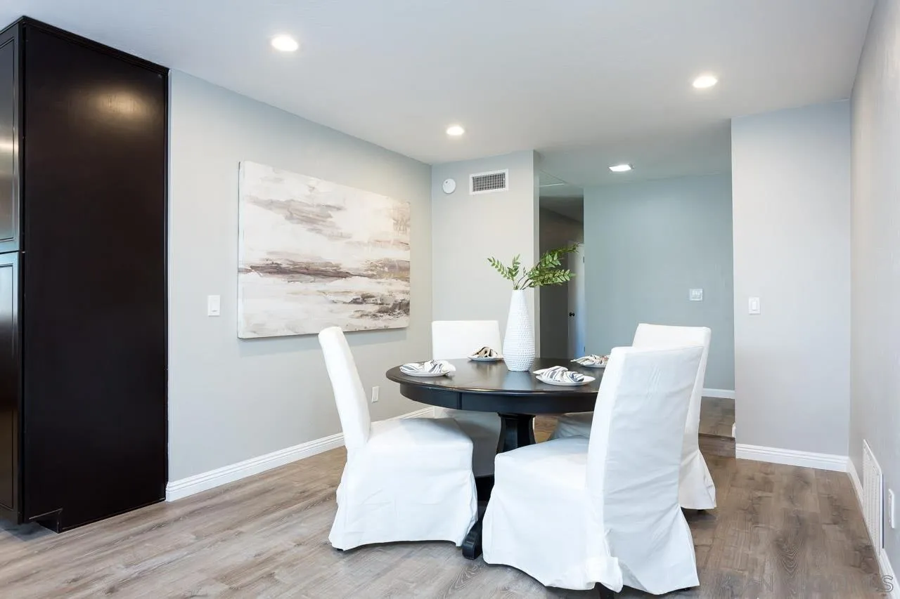 14427 Mirando Street Poway, CA 92064 - Photo 9 of 33 a dining room with furniture and wooden floor