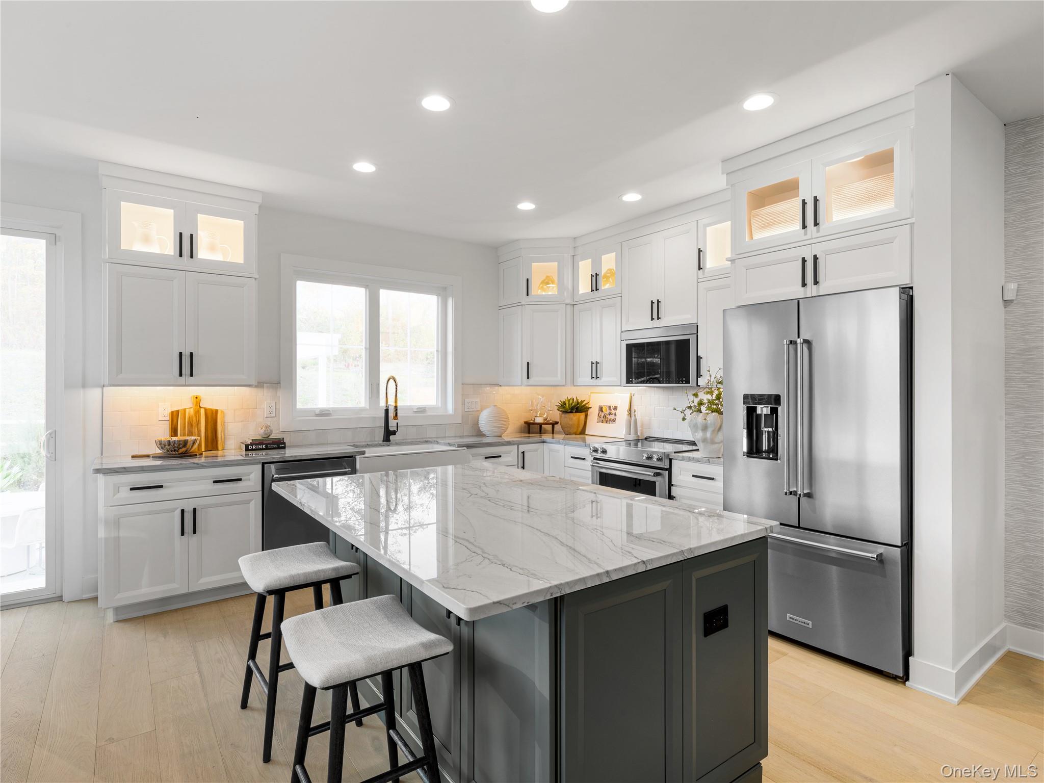 5110 Teaberry Lane, Unit 31 Fishkill, NY 12524 - Photo 8 of 10 Kitchen with white cabinetry, light stone counters, glass insert cabinets, and recessed lighting