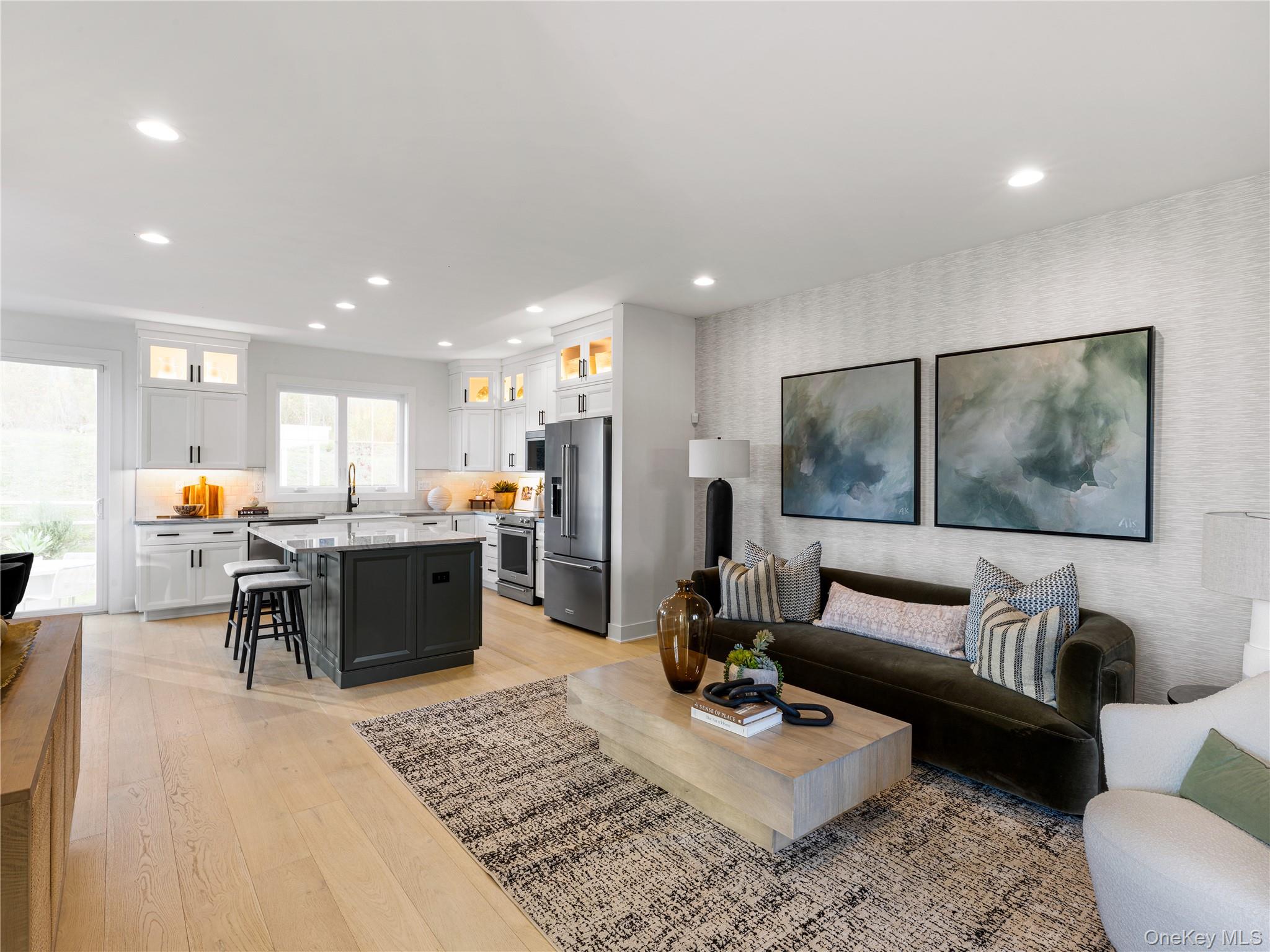 5110 Teaberry Lane, Unit 31 Fishkill, NY 12524 - Photo 9 of 10 Living area with light wood finished floors, recessed lighting, and wallpapered walls