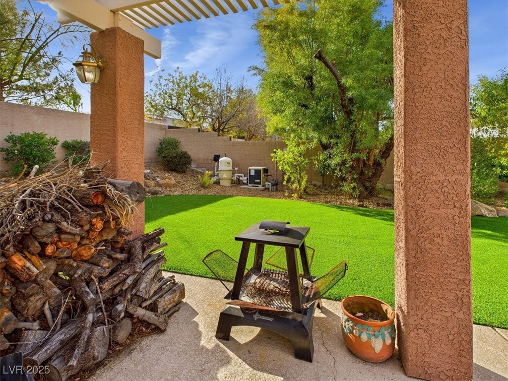 321 Whispering Tree Avenue Las Vegas, NV 89183 - Photo 80 of 95 Fenced backyard with a patio and a pergola
