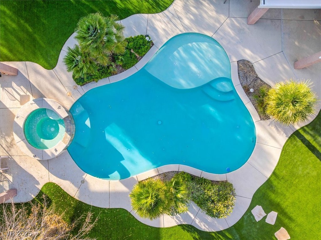 321 Whispering Tree Avenue Las Vegas, NV 89183 - Photo 83 of 95 View of swimming pool featuring a pool with connected hot tub