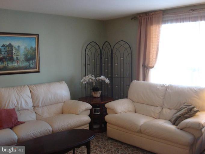1009 Downton Road Halethorpe, MD 21227 - Photo 2 of 30 a living room with furniture and a large window
