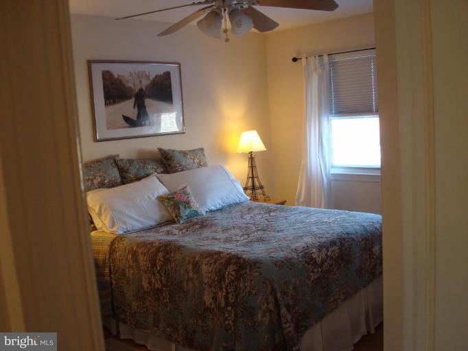 1009 Downton Road Halethorpe, MD 21227 - Photo 14 of 30 a bedroom with a bed and a window